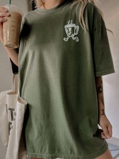 These tees are printed on super soft Comfort Colors, providing a relaxed unisex fit with a worn-in look and feel. This collection offers our most expanded size range from S-3X.Looking for these tees to fit oversized? Size up 1-2 sizes.Model is wearing a size XL for an oversized fit• 100% ring-spun cotton• Garment-dyed• Relaxed fitThis product is made especially for you as soon as you place an order, please see the banner on the top of our site for current turnaround times. Making products on dem Casual Green T-shirt For Everyday, Casual Crew Neck T-shirt For Loungewear, Oversized Casual T-shirt For Loungewear, Comfortable Graphic Print T-shirt, Relaxed Fit Comfortable Crew Neck T-shirt, Everyday Crew Neck T-shirt In Ring-spun Cotton, Everyday Screen Print T-shirt In Ring-spun Cotton, Graphic Tee With Crew Neck, Everyday Crew Neck T-shirt With Screen Print