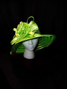 Limelight Derby Hat This vibrant hat is a statement piece that will turn heads. With its bold lime green color and elegant floral design, it's perfect for adding a touch of whimsy to any outfit. Eye-Catching Lime Green: A vibrant color that will make you stand out. Delicate Floral Design: A beautiful, feminine touch. Versatile Styling: Can be worn in various ways to suit your style. Perfect for Special Occasions: Ideal for weddings, tea parties, and other formal events. Make a Statement Today! Elevate your style with this unique accessory--shop now and turn heads at your next event! Brimmed Party Costume Hats And Headpieces, Party Bucket Hat, One Size Fits Most, Party Fascinator With Curved Brim, One Size, Adjustable Fedora Fascinator For Church, Green Fedora Straw Hat For Kentucky Derby, Adjustable Fedora-style Fascinator For Church, Adjustable Cloche Headpieces For Kentucky Derby, Short Brim Hat For Church, One Size Fits Most, Adjustable Hat For Kentucky Derby Party