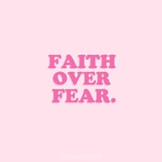 the words faith over fear written in pink on a pink background