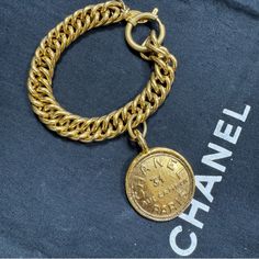 Vintage Chanel Bracelet From The Late 1970's - Early 1980's Collection 100% Authentic Made In France Gold Plated Excellent Condition Overall Aside From Light Wear And Scratches Throughout Metal Measurements Approx.: Inside Circumference: 8.5" Ornament-Length: 1.75" Ornament Width: 1.25" Comes With Box Luxury Chain Bracelet With Logo Charm, Vintage Gold Bracelet With Logo Charm, Vintage Gold Jewelry Aaa Quality, 31 Rue Cambon, Vintage Chanel Jewelry, Chanel Bracelet, Chanel Jewelry, Vintage Chanel, Bracelet Gold