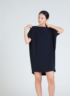 KAAREM - Angle Mini Dolman Open Back Dress - Black Blue Chic Short Sleeve Button Back Dress, Chic Short Sleeve Dress With Button Back, Mini Dress With Draped Sleeves For Work, Workwear Mini Dress With Draped Sleeves, Elegant Oversized Mini Dress, Oversized Mini Length Dresses For Daywear, Oversized Chic Knee-length Mini Dress, Chic Oversized Short Sleeve Mini Dress, Chic Oversized Mini Dress