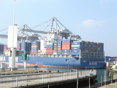 a large cargo ship is docked at the dock