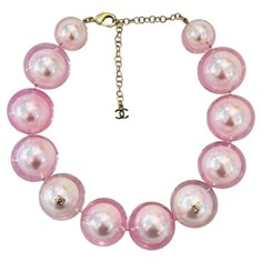 Rare Item - Chanel Ltd Edition 'CC' Logo Pearl Choker Necklace Oversized baby pink faux pearl choker encased in clear resin and detailed with gold 'CC' logo embellishments. Adjustable lobster clasp and a dangle chain with 'CC' logo. From Summer 2017 Collection. Size – One Size Condition – Very Good Composition – Faux Pearls Comes with – Necklace Only Cher Horowitz Jewelry, Star Necklace Gold, Chanel Necklace, Chanel Pearls, Chocker Necklace, Pink Chanel, Pearl Choker Necklace, Pierced Jewelry, Chanel Vintage