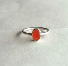 Pure carnelian Ring, 925 Sterling Silver Ring, Carnelian Jewelry , Handmade Ring , Carnelian Ring , Birthstone Jewelry, Proposal Ring. Details Handmade item Delivery from a small business in India Materials: Silver, Stone Gemstone: Onyx Gem colour: Orange Band colour: Silver Style: Art deco Recycled Made to Order Description Stone Name - Natural Carnelian Cabochon Cut Grade - Smooth Quality - AA- AAA Metal - 925 Sterling Silver Payment Policy We accept payment through PayPal Payment should be ma Oval Carnelian Orange Ring, Orange Carnelian Oval Cabochon Jewelry, Oval Orange Carnelian Rings, Orange Oval Carnelian Rings, Handmade Orange Carnelian Rings, Red Gemstone Ring, Carnelian Jewelry, Carnelian Ring, Ring Birthstone