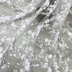 ❤Super gorgeous, exquisite embroidery flowers. Highly recommended to brides! ! ❤ Very delicate and romantic. It can be used for wedding decorations, boho dresses, bridal outfits, tops, clothing fabrics, corsets, curtains, etc... Size Width: 120cm (47.24 inches) This listing is for 1 yard. Wholesale Available If you need more, please feel free to contact me for a custom list. We usually process your order within 3-5 days, standard shipping will take about 10-15 days, some country may need more ti White Lace Fabric With Floral Applique, Delicate White Lace For Wedding Night, Delicate White Wedding Dress, Delicate Floral Embroidered Tulle Fabric For Wedding, White Tulle Fabric With Floral Embroidery For Wedding, Delicate White Lace Wedding Dress, White Lace Tulle Fabric With Floral Applique, Delicate White Tulle Fabric For Wedding, White Intricate Embroidery Lace For Bride