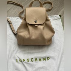 Longchamp Backpack Lambskin Leather, Made In France Dustbag Included Size Leather Top Handle, 2" Drop Adjustable Leather Backpack Straps, 11.5"-14" Drop 10"W X 10"H X 5"D Color: Gesso Longchamp Backpack, Longchamp Leather, Longchamp Bags, Backpack Straps, Leather Top, Lambskin Leather, Leather Backpack, Dust Bag, Bag Lady