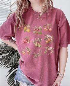 Cute Vintage Fruits Graphic Tee ✨ SIZING & MATERIALS: Printed on Unisex Comfort Colors c1717 garment-dyed t-shirt for a relaxed fit; the fabric brings extra coziness to your wardrobe while the relaxed fit makes it an excellent daily choice.  .: 100% ring-spun cotton .: Medium fabric (6.1 oz/yd² (206.8 g/m *Sizing down one size will give you a more fitted look* *Sticking with your normal size gives a nice relaxed look* *Sizing up 1-2 sizes gives an oversized look* Please compare measurements agai Fruit Botanical, Fruit Shirt, Front Tuck, Cottagecore Vintage, Vintage Fruit, Vintage Cottagecore, Oversized Look, Look Plus, Styling Ideas