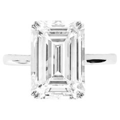 This luxurious ring features a 6.03 carat emerald cut diamond, certified by the GIA. The diamond exhibits an H color grade and VS1 clarity, ensuring exceptional brilliance and clarity. With an excellent polish and symmetry, the diamond's cut enhances its elegant appearance. The absence of fluorescence ensures a pure and natural glow. Set in a sophisticated 18K white gold band, this ring embodies timeless elegance and refinement. 7 Carat Diamond Ring, Asscher Cut Diamond Ring, Sapphire Solitaire Ring, Contemporary Engagement Rings, Emerald Cut Diamond Ring, Oval Diamond Ring, Emerald Cut Engagement, Platinum Diamond Rings, Sapphire Solitaire