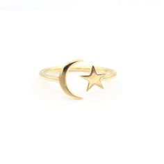 Description When you wish upon a star... you end up with our Star & Moon Celestial Ring. Featuring a shining star sitting perfectly in the crescent of the moon, this open ring is adjustable, and can comfortably move from finger to finger, making it as versatile as it is fun. Please Note: If you don't see your size available, let us know - our master jeweler has over 40 years of experience, and we can accommodate all sizing and customization requests. Item Details This ring is constructed of stur Celestial Moon Midi Rings As Promise Ring, Celestial Moon Midi Rings For Promise, Celestial Moon-shaped Midi Promise Rings, Luxury Open Celestial Ring, Adjustable Moon Shaped Celestial Midi Rings, Dainty Adjustable Crescent Ring, Adjustable Gold Midi Rings With Moon Shape, Adjustable Celestial Moon Midi Rings, Celestial Crescent 14k Gold Ring