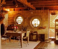 an old fashioned dining room with round windows