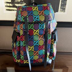 2020 Special Projects Medium Gg Psychedelic Carry. On Duffle 601294 Hpudn 1058 A Modern Take On The Historic Gg Pattern, The Gg Psychedelic Motif Decorates Classic Shapes Throughout The Cruise 2020 Collection, Including The Carry-On Duffle Bag. Seen Throughout Ready. To-Wear And Accessories, The Monogram Is Presented In Brightly Shaded Hues With A Star Design That Creates A Hologram Effect. Gg Psychedelic Supreme Canvas, A Material With Low Environmental Impact Black Metal-Free Tanned Leather Tr Designer Multicolor Travel Bags, Designer Multicolor Bag With Adjustable Strap, Designer Multicolor Bags With Adjustable Strap, Gucci Multicolor Bag For Everyday Use, Gucci Travel Backpack With Adjustable Strap, Designer Multicolor Gucci Bag, Gucci Black Backpack For Travel, Luxury Multicolor Gucci Bags, Black Gucci Backpack For Travel