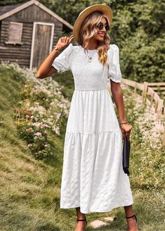 This maxi dress has a smocked bodice and tiered skirt for a breezy, romantic look. Perfect for a day at the beach or a night out, this dress will make you feel like you're living in a seaside fantasy. (No boring ol' landlubber attire here, matey!) Size Guide: Model is 5’8” tall, and has a 33.8” bust, 24.2” waist, & 35.7” hips. She is wearing a S / US 4 / AU 8. This dress is true to size. Material: Self: 100% Nylon, Lining: 100% Polyester Feature: V-Neckline. Short Sleeves. Crochet waist. Lace fabrication. Lined. Maxi length. Flowy fit. Care Instructions: Machine wash / Cold hand wash Summer Maxi Dress With Elastic Neckline For Daywear, Summer Daywear Maxi Dress With Elastic Neckline, Casual Billowy Smocked Summer Dress, Chic Billowy Smocked Summer Dress, Flowy Tiered Sundress Smocked Dress, Billowy Smocked Bodice Dress For Summer, Day Out Tiered Dress With Smocked Bodice, Flowy Smocked Tiered Skirt Dress For Day Out, Summer Dress With Smocked Bodice