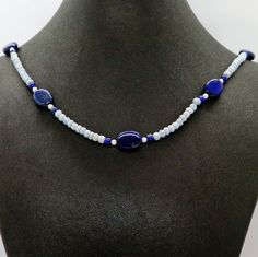 The Lapis Lazuli Blue Lace Agate Freshwater Pearl and Sterling Silver Adjustable Gemstone Necklace is a beautiful jewelry piece that combines natural gemstones with sterling silver. It features lapis lazuli, blue lace agate, freshwater pearls, and sterling silver beads, creating a harmonious mix of colors and textures. The adjustable design allows for customization of the length. This necklace adds sophistication to any outfit. #GemstoneNecklace #SterlingSilverJewelry #RivendellRocksSedona Blue Necklaces With Adjustable Oval Beads, Blue Beaded Gemstones For Gift, Beaded Blue Gemstones For Gift, Elegant Blue Oval Beaded Jewelry, Elegant Blue Oval Beads Jewelry, Sapphire Color Lapis Lazuli Necklace, Spiritual Blue Necklace With Oval Beads, Blue Oval Beads Necklace For Gift, Blue Oval Beaded Necklaces With Natural Stones