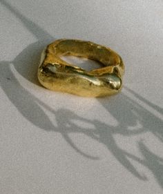 The Mel-Dorn ring, a molten, chunky brass ring with a high polish, crafted in pure brass. One of a kind and completely handmade. Hand Cast Gold Brass Ring, Hand-cast Gold Brass Rings, Hand Forged Gold Brutalist Jewelry, Brutalist Hand Forged Gold Jewelry, Gold Brutalist Hand Cast Jewelry, Gold Brutalist Hand-cast Jewelry, Unique Gold Brass Signet Ring, Handmade Brass Open Signet Ring, Brutalist Hand-cast Gold Jewelry