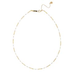 Indulge in the exquisite craftsmanship of our Handmade 18K Tube Beading Ceramic Chain. This one-of-a-kind necklace is made with 18K gold and features a unique ceramic chain. With a length of 16-18" and our signature silicon slide extender, this piece will elevate any outfit. White Pearl Chain Necklace With Round Beads, Luxury White Chain Necklace With Adjustable Chain, Dainty Single Strand White Chain Necklace, Dainty White Single Strand Chain Necklace, Dainty White Beaded Chain Necklace, Luxury Necklace With Pearl Chain And Round Beads, Luxury Pearl Chain Necklace With Round Beads, White Beaded Chain Necklace For Gift, White Dainty Beaded Necklace With Adjustable Chain