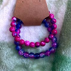 Pink And Purple Beaded Bracelet Set (Two Included) Adjustable Purple Faceted Beads, Casual Purple Bracelets With Colorful Beads, Purple Round Beaded Bracelet, Adjustable Purple Hand-strung Stretch Bracelet, Adjustable Hand-strung Purple Stretch Bracelet, Lavender Bracelets With Colorful Beads, Adjustable Purple Beaded Bracelets With Round Beads, Handmade Purple Stretch Bracelet, Adjustable Purple Beaded Bracelets With Faceted Beads