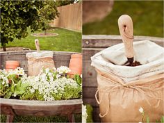 an umbrella and some flowers in a wooden basket on the grass with other items around it