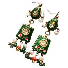 Beautiful vintage 10kt gold , hand - painted Mughal earrings with fresh water cultured pearls , paste stones , coral and emerald beads at bottom . These kundan style jewelry is handmade and is wax filled with gold or silver sheet on top as these earrings . Hand made in northern part of India in mid 20th century . Antique Hallmarked Earrings For Festive Occasion, Vintage Chandbali Jewelry For Celebrations, Vintage Kundan Ceremonial Jewelry, Chandbali Shaped Jeweled Jewelry Gift, Vintage Kundan Jewelry For Ceremonial Occasions, Traditional Enamel Jewelry With Matching Earrings, Vintage Jewelry For Diwali Festive Season, Vintage Jewelry For Diwali, Vintage Earrings For Festivals