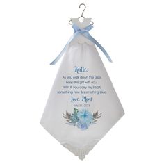 a blue and white wedding handkerchief hanging from a hook