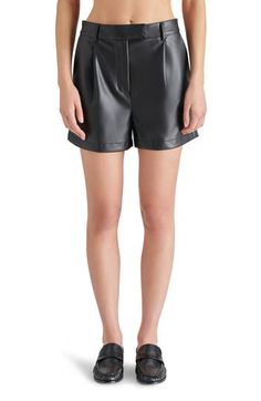 Buttery faux-leather shorts get a modern update with a high waist, perfectly polished pleats and handy pockets for essentials. 3 1/2" inseam; 28" leg opening; 12" front rise; 15" back rise (size medium) Zip fly with hook-and-bar closure Front slant pockets; back welt pockets 100% polyurethane Spot clean Imported Leather High-waisted Shorts With Belt Loops, High-waisted Leather Shorts With Belt Loops, Fitted Leather High-waisted Shorts, Fitted High-waisted Leather Shorts, Sleek Leather Shorts, Fitted Leather Shorts For Work, Chic Leather High-waisted Shorts, Chic High Waist Leather Shorts, Chic High-waist Leather Shorts