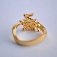 "Simply stunning! Beautiful handcrafted 14k Gold two name ring. This lovely custom made ring is perfect for that special and crazy relationship between the 'two-of-you'. Husband-wife, mother daughter, best friends, brothers, sisters and all of your loved ones - to own or to gift :) Important dates/coordinates can also be made. We will send a drawing before starting the manufacturing process so you know what it will look like. SENDING AS A GIFT We would be happy to send your gift directly to the Customized Gold Engraved Promise Ring, Customized Gold Engraved Wedding Ring, Unique Engraved 14k Gold Ring For Wedding, Custom Engraved Yellow Gold Ring For Anniversary, Customized Elegant Rings For Anniversary, Customized Yellow Gold Rings For Anniversary, Elegant Customized Rings For Anniversary, Elegant Customized Rings As Gift, Customized Gold Engraved Elegant Ring