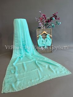 Shinori silk- Aqua mirror work This stunning Chinoori Silk- Aqua Mirror Work features intricate Shinori silk- Aqua mirror work. The elegant, handmade work is sure to add a statement to any look. Handcrafted with care and precision, you'll look timeless in this eye-catching piece. The Saree is provided with a matching sareeskirt / petticoat. Fancy Clutch, Kids Wear Boys, Mens Sherwani, Kids Wear Girls, Block Print Saree, Fancy Gowns, Silk Thread Bangles, Silk Saree Banarasi, Bridal Silk Saree