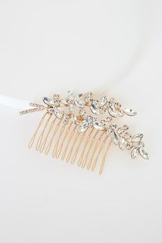 Lulus Exclusive! Add that final, perfect touch to your special day with the Lulus Perfect Finale Gold Rhinestone Barrette! This gorgeous hair comb features gleaming silver rhinestones that form a flower branch-inspired design and sits atop a shiny gold comb. Wear as an accent to your gorgeous updo, or as a perfect touch to a side braid style! Measures 4" long. Brass, Steel, Glass. Imported. Lulus | Perfect Finale Gold Rhinestone Barrette. Rhinestone Barrette, Silver Rhinestone Headband, White Hair Clip, Gold Hair Clips, Bridal Hair Clip, Accessory Ideas, One Fine Day, Courthouse Wedding, Side Braid