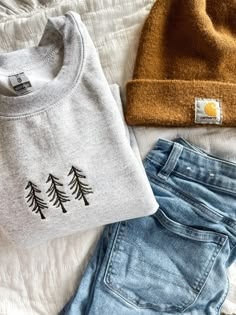 The cozy accessory your closet has been missing 🌲 This is a made to order item. Please allow 1-2 weeks before item is shipped.  Embroidered crewneck sweatshirt. Color: ash gray. 50% preshrunk cotton, 50 % polyester. Design is approximately 4 inches wide. Womens Winter Sweater, Minimalist Embroidery Ideas, Embroider Pine Tree, Granola Teacher Aesthetic, Cricut Crewneck, Pnw Clothing Style, Fall Crewneck Sweatshirt Embroidery, Fall Crew Neck Sweater With Custom Embroidery, Casual Christmas Sweater With Embroidery