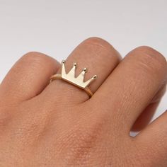 "Shiny Crown Ring Real 10K Yellow Gold * Metal : Real 10K Yellow Gold (Properly Stamped, 10K) * Condition : Brand New * Finish : Polished * Average Weight : 2.53 grams * Size : 6 * Width : 8.5mm x 15.5mm = Just over 1/4\" x 5/8\" * Clasp/Bail : Can be resized down or up at your local jeweler All of our items are brand new and are shipped with a gift box." 14k Gold Crown Design Fine Jewelry, Yellow Gold Diamond Ring With Crown Design As Gift, Crown Shaped 14k Yellow Gold Jewelry, 14k Gold Crown Design Diamond Ring, Gold Crown Design Diamond Ring In 14k Gold, Gold Diamond Ring With Crown Design In 14k, 14k Gold Crown Design Jewelry As A Gift, Crown Shaped Fine Jewelry Rings For Gifts, 14k Gold Jewelry With Crown Design For Gift