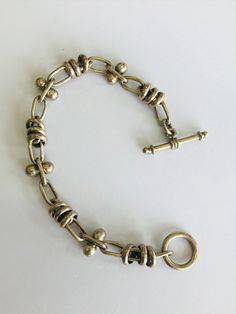 This is a vintage, sterling silver (.925) bracelet. Material(s): Sterling Silver (.925) Weight: 23.5 grams Flaws (if any): None to mention Marking(s): None to mention This bracelet measures 7.5 inches. If you have any questions about this bracelet, please do not hesitate to contact us! ♥ Antique Sterling Silver Bracelet Stamped 925 For Formal Occasions, Antique Sterling Silver Bracelet Formal Stamped 925, Classic Sterling Silver Hallmarked Oval Link Bracelet, Classic Hallmarked Sterling Silver Oval Link Bracelet, Hallmarked Vintage Sterling Silver Bracelet, Vintage Hallmarked Sterling Silver Bracelet, Vintage Sterling Silver Hallmarked Bracelet For Gift, Vintage Gold Sterling Silver Bracelet, Vintage Hallmarked Sterling Silver Bracelet Gift