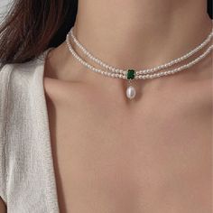 Introducing the epitome of elegance and style - Gorgeous emerald green natural pearl pendant double layering pearl necklace choker. Beautiful stunning gold laced green emerald matches with pearls, luxurious classic elegance. Double layer strands 2mm pearl beaded chain looks exquisitely delicate. Emerald gemstone is super eye catching, stylish with vintage vibes! Crafted with the finest quality faux pearls, this choker boasts a double layer design that sits comfortably on your neck, creating a ch Pearl Choker With Pendant, Elegant Green Pearl Drop Necklaces, Elegant Green Necklaces With Pearl Drop, Pearl And Emerald Necklace, Elegant Green Pearl Necklace With Pendant, Elegant Green Double Strand Jewelry, Elegant Green Pearl Necklace For Gift, Elegant Green Jewelry With Pearl Charm, Diy Pearl Necklace