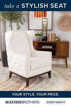 a white chair sitting on top of a rug