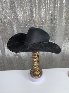 Our "Blacked Out" hat features our square black hat+ jet black rhinestones on both brims. Perfect for those wanting a rhinestone hat but with more of a slightly subdued look due to the black rhinestones. Don’t be fooled, this hat is gorgeous and the jet black rhinestones sparkle and shine! This can easily go with any outfit and can be worn all year long. This hat features: Black square straw hat Jet black rhinestones on both brim Matching black hat band Sizing: Our black hats have both sizes S/M Black Glitter Cowboy Hat, Black Rhinestone Cowboy Hat, Western Style Fedora With Curved Brim For Parties, Western Fedora With Curved Brim For Parties, Western Style Party Top Hat With Curved Brim, Western Style Curved Brim Top Hat For Party, Western Style Top Hat With Curved Brim For Party, Western Style Party Top Hat With Short Brim, Western Flat Brim Party Hats