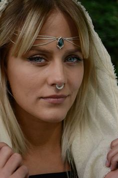 The Silver Head Chain features a drop-shaped gemstone with round balls on the lower edge. Worn draped over the crown of the head or as a Necklace. The Labradorite centrepiece is decorated with 3 chains draped on each side. This piece of jewelry work well dressed up or worn casually. This timeless design is perfect for festivals, weddings & any day that needs some extra sparkle! Size Guide: Adjustable size with a lobster clasp on the backside Material: Brass (nickel free) Stone: Drop-shaped L Nickel Free Mystical Moonstone Jewelry, Nickel-free Mystical Moonstone Jewelry, Mystical Nickel-free Moonstone Jewelry, Bohemian Sterling Silver Jewelry With Silver Chain, Silver Jewelry With Jewels For Festivals, Silver Teardrop Necklace For Festivals, Silver Teardrop Necklace For Festival, Festival Silver Teardrop Necklaces, Bohemian Silver Beads Jewelry As Gift