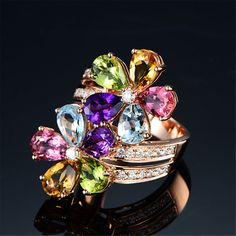 Bring timeless glamour and a glittering accent to your ensembles with this vibrant flower crystal ring. Face : 0.57" W x 1.02" H 18k rose gold-plated copper / cubic zirconia / crystal Jewelry Rose Gold, Gold Color Ring, Flower Band, Rainbow Crystal, Crystal Flower, Elegant Ring, Delicate Rings, Open Ring, Rose Gold Color