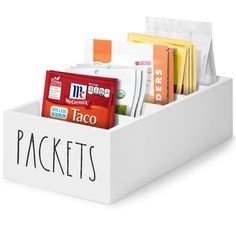 a white box filled with taco packets