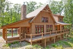 a large wooden cabin in the woods