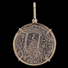 Atocha Round 8 Reale Silver Coin Pendant Item Number - ST-7003P Frame - Solid 14K Gold Medium Wrap with Large Bale Dimensions - 1 1/4" diameter (about the size of half-dollar) Weight - 11.8 grams Now You Can Own a Piece of History! Atocha Silver is More Pure than Sterling Silver! The silver coin was hand cast using a formulated blend of silver ingots recovered from the Sunken Treasure of the Nuestra Senora de Atocha and fine Sterling Silver. The Nuestra Senora de Atocha (Our Lady of Atocha) Span Anniversary Amulet Style Jewelry With Coin Pendant, Anniversary Amulet Jewelry With Coin Pendant, Anniversary Jewelry With Coin Pendant Charm, Engraved Coin-shaped Amulet Jewelry, Commemorative Coin Pendant Medallion Jewelry, Commemorative Medallion Coin Pendant Jewelry, Round Locket Jewelry For Commemoration, Traditional Round Jewelry For Commemoration, Commemorative Locket Jewelry