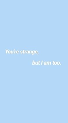 the words you're strange, but i am too written in white on a blue background