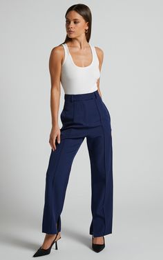 Slay the pants game with our Rogers Pants in Navy! These tailored pants are perfect for both workwear and casual occasions. The navy color adds a touch of sophistication, while the full-length style keeps you looking stylish all summer long.Pair them with your favorite high heels to elongate those legs and show off your feminine side. You'll love how comfortable these pants feel, making them the perfect addition to your wardrobe. Don't let another day go by without these must-have Rogers Pants - Blue Dress Pants Outfit Women Navy, Navy Straight Leg Dress Pants For Work, Trendy Ankle-length Workwear Pants, Navy Straight Pants For Business Casual, Navy Stretch Pants For Business Casual, Summer Straight Leg Business Casual Work Pants, Straight Leg Work Pants For Business Casual In Summer, Summer Business Casual Straight Leg Work Pants, Navy High-waisted Pants For Business Casual