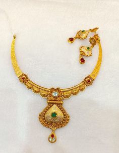 22k Real Gold Necklace Set with Gold Earrings-Antique Gold Necklace- Indian Gold Necklace- wedding Gift-Solid Gold Necklace- Gold jewellery  This is beautifully handmade Antique 22k Solid Gold Necklace along with the real gold Earrings designed in Antique theme with the touch of gemstones that gives it aesthetic look and enhances your beauty! PRODUCT SPECIFICATIONS: Material: 22k Solid Gold Weight: 42 grams approx  Design: Antique  Customer satisfaction is our utmost priority, feel free to have any query, would love to assist you! We accept custom orders as well! Jai Shree Shyam 🙏🙏 Happy Shopping 🛍️ Ganga Jamuna Gold Necklace, Goan Gold Necklace, Luxury Yellow Gold Necklace For Puja, 30 Grams Gold Necklace Indian Set, Dual-tone Kundan Chandbali Necklace For Wedding, 22k Gold Dual-tone Jewelry For Wedding, Dual-tone Chandbali Kundan Necklace For Wedding, Dual-tone 22k Gold Wedding Jewelry, Ornate Gold Kundan Jewelry Sets