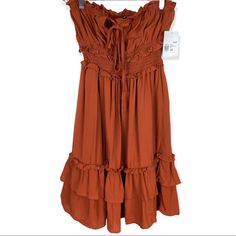 Forever 21 Ruffle Trim Mini Dress Rust Color Self Tie Chest Smocked Waist Size Xs Measurements Are Approx Laid Flat Pit To Pit 14” Length 27” Strapless Summer Midi Dress With Ruffles, Forever 21 Ruffled Mini Dress For Day Out, Forever 21 Mini Dress With Ruffles For Day Out, Forever 21 Ruffled Mini Dress For Brunch, Forever 21 Ruffled Mini Dress, Forever 21 Flowy Ruffled Dresses, Forever 21 Ruffled Mini Dress For Beach, Summer Ruched Mini Dress By Forever 21, Forever 21 Ruffled Mini Dress For The Beach