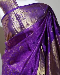 Part of our premium silks collection. Pure Kanchipuram Handloom Saree. Royal, purple saree with golden zari and matching blouse material (see last pic) Silk Mark Certified. Festive Purple Silk Pre-draped Saree, Purple Self-design Pre-draped Saree For Puja, Purple Katan Silk Pre-draped Saree With Cutdana, Purple Katan Silk Pre-draped Saree With Zari Work, Traditional Purple Pre-draped Saree For Puja, Purple Art Silk Pre-draped Saree With Self Design, Purple Pre-draped Saree For Puja, Anarkali-style Pre-draped Saree With Pallu In Purple, Purple Silk Pre-draped Saree For Wedding