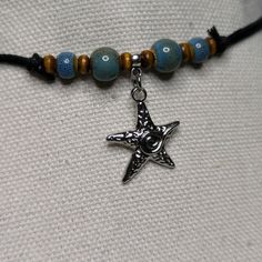 Looking for a unique and eye-catching accessory to add to your collection? Look no further than this Ceramic Beaded Starfish Spiral Swirl Charm Boho Hippie Whimsical Adjustable Black Rope Cord Choker Stacking Necklace. Crafted from high-quality ceramic beads this whimsical necklace is the perfect addition to your boho-inspired wardrobe. With ten different color options available, each necklace is made-to-order and features a slightly unique color variation. Designed on an adjustable waxed black Adjustable Metal Charm Necklaces For Festivals, Adjustable Metal Pendant Beaded Necklaces, Unique Adjustable Charm Necklace, Symbolic Beaded Jewelry For Festivals, Symbolic Festival Beaded Jewelry, Adjustable Spiral Necklace Nickel Free, Adjustable Spiral Nickel-free Necklace, Adjustable Metal Beaded Necklaces For Gifts, Adjustable Spiritual Metal Beaded Necklaces