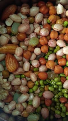 beans, peas and carrots are mixed together in a pot to make a meal