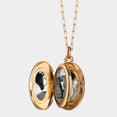 Monica Rich Kosann locket necklace. 18-karat yellow gold. Oval locket with pav diamond border. 0.336 total diamond carat weight. Locket opens to display four photos. Chain, approx. 30"L. Pendant drop, approx. 1.3"L. Lobster clasp. Imported. Luxury Polished Pendant Locket Necklace, Luxury Yellow Gold Oval Locket Necklace, Yellow Gold Polished Pendant Locket Necklace, Fine Jewelry Locket Pendant Necklace, Luxury Medallion Locket Necklace, Luxury Medallion Locket Necklace For Formal Occasions, Luxury Locket Necklace, Luxury Locket Necklace For Formal Occasions, Luxury Medallion Locket Necklace As Gift