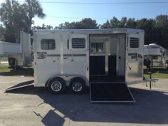 a horse trailer parked in a parking lot