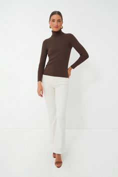 The Arlo Turtleneck Sweater is a classic layering piece that you’ll be wearing all season long, year after year. In a super comfy, stretch ribbed fabric, this fitted silhouette can be worn under a cardigan or tucked into your favorite denim. Style this versatile number under a blazer for a chic office outfit to give you a confidence boost before your next meeting or with mini skirts for effortless seasonal transitions. Fold back turtleneck Long sleeves Fitted Ribbed fabric Material: 43% Rayon, 2 Chic Office Outfit, Plus And Minus, Office Outfit, Ribbed Turtleneck, Chic Office, Confidence Boost, Denim Style, Fitted Silhouette, Office Outfits