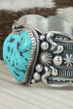 This Sleeping Beauty turquoise and sterling silver bracelet was made by Navajo silversmith Roland Dixson. The inside is signed and stamped sterling.Size: 5 3/4" (will fit up to a 7 1/4" wrist)Gap: 1 1/2"Width: 1 1/2"Free shipping on all orders! We ship with USPS and always include tracking. All orders ship within a day of payment.Returns are accepted up to 30 days after you receive your order. Just send us a message. Our shop offers cash back or store credit. The item must be returned in new con Southwestern Stamped Turquoise Sterling Silver Bracelet, Southwestern Turquoise Stamped Sterling Silver Bracelet, Southwestern Style Sterling Silver Turquoise Bracelet, Western Style Turquoise Stamped Bracelets, Western Style Blue Sterling Silver Bracelet Gift, Turquoise Western Style Collectible Bracelets, Artisan Sterling Silver Turquoise Bracelet Collectible, Western Style Blue Sterling Silver Collectible Bracelet, Western Style Blue Sterling Silver Bracelet Collectible