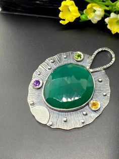 "Artisan Green Onyx gemstone pendant in sterling silver Hand-made Sterling Silver 925 Stones used: Faceted Green Onyx, Chrome Diopside, Amethyst, Citrine Height - 1 7/8\" (with bail), Width - 1 3/8\" Unique Handcrafted One-of a-kind Design Pendant Each Piece of Jewelry in my Collection is Absolutely One of a Kind! When you start wearing a piece of my jewelry you will fall in love with it more and more each day and feel that good Energy and Love that I pass into it while creating this piece of Ar Fusion Style Jewelry With May Birthstone For Gift, Fusion Style May Birthstone Jewelry Gift, May Birthstone Fusion Style Gift Jewelry, Emerald Large Pendant Jewelry Gift, Fusion Style Emerald Jewelry As A Gift, Fusion Style Emerald Jewelry For Gifts, Fusion Style Emerald Jewelry Gift, Emerald Pendant Gemstone For Gift, Emerald Pendant Gemstone As Gift